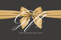Gift card design with a gold bow on a dark background, featuring the brand 'DushizCloset'.